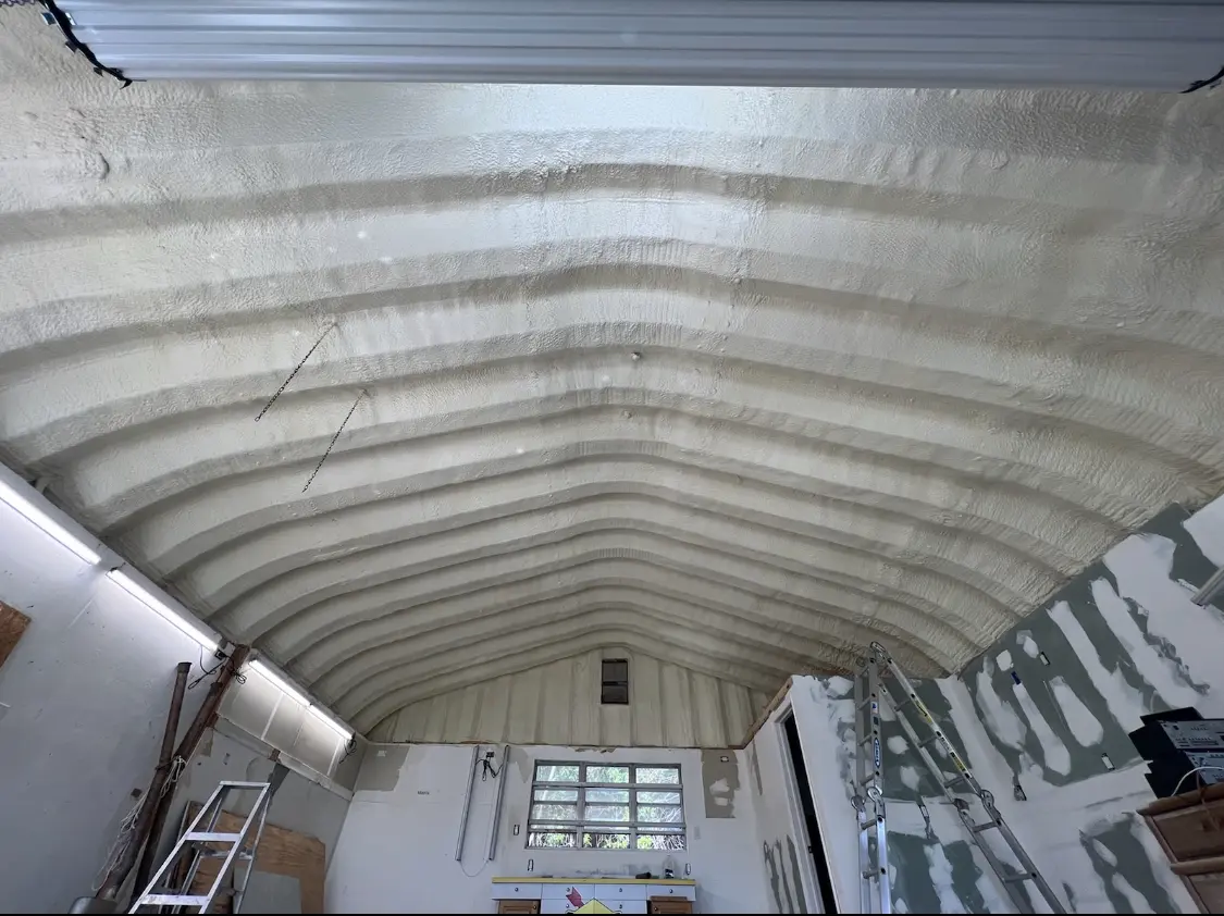 Spray polyurethane foam applied to the underside of a metal roof deck in Excelsior Springs